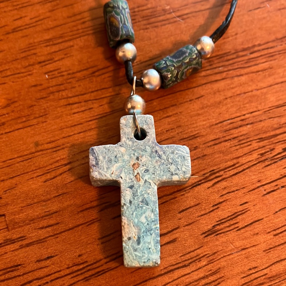 Beautiful boho style necklace with chunky blue stone cross on a leather cord.